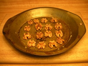 Spread nuts onto baking sheet