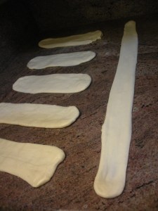 Holding each rectangle end, stretch & slap into a long belt